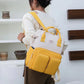 Sac à dos bébé beige et jaune